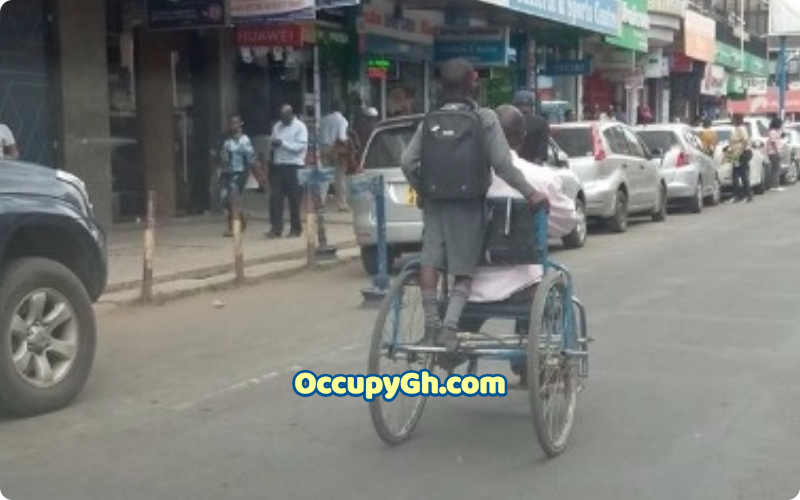 disabled father taking son to school
