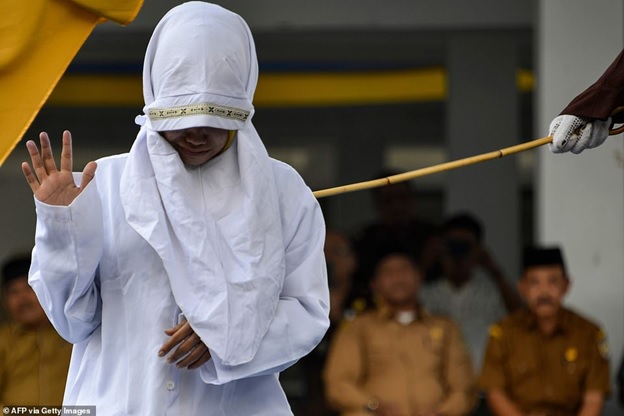 Muslim Woman Who Has S.E.X Outside Marriage Caned In Public (PHOTOS)