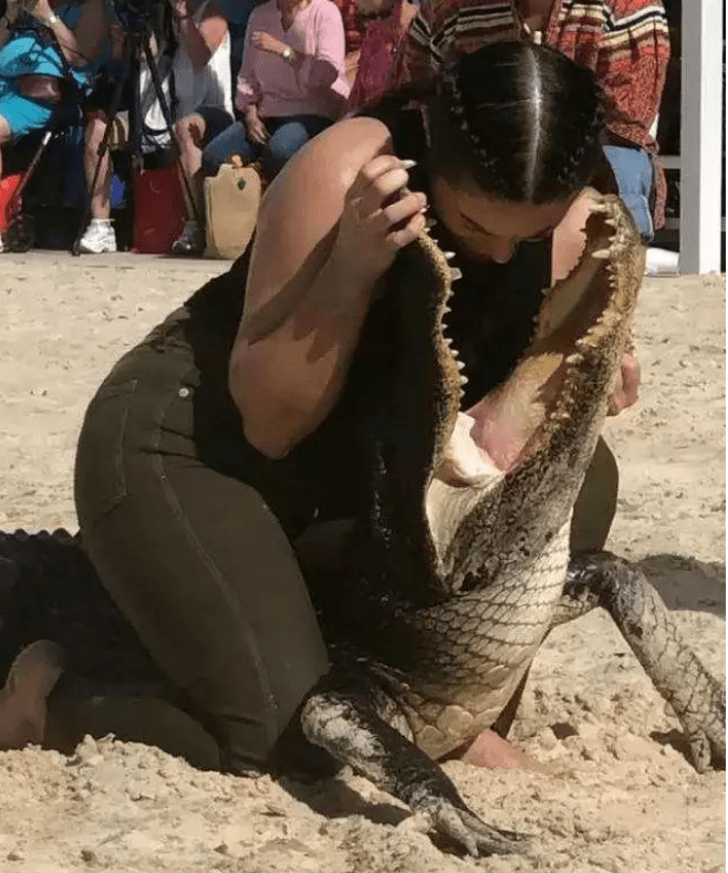 lady stuck head in crocodile