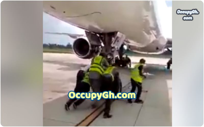 nigerians pushing airplane