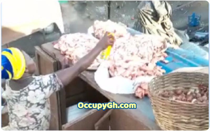 woman spraying mosquito spray on meat