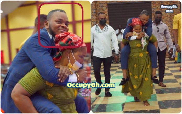 angel obinim woman carries obinim on her back