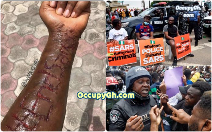 end sars man Inscribes #EndSARS On hand