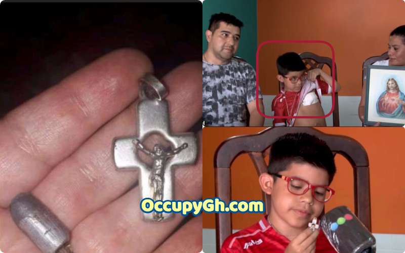 boy saved crucifix necklace
