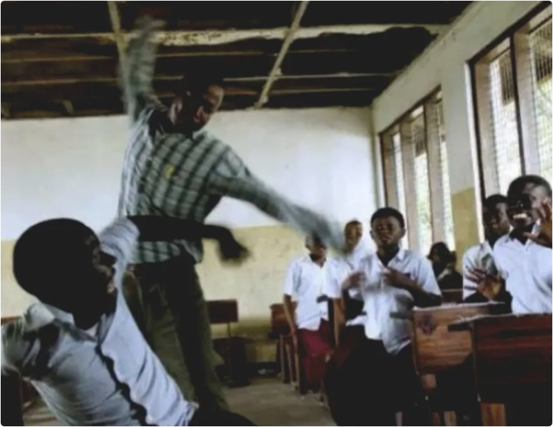 mother storms school cane lash teacher