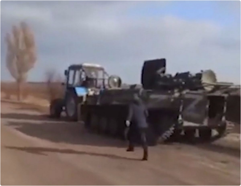 Moment Ukrainian Farmer Uses His Tractor To Steal Russian Armored Tank (VIDEO)