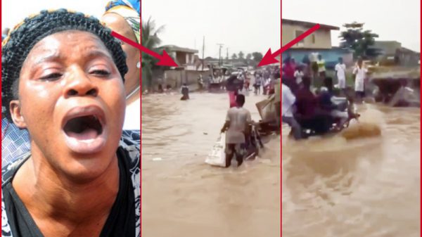 man on motorbike swept by flood water in lagos nigeria