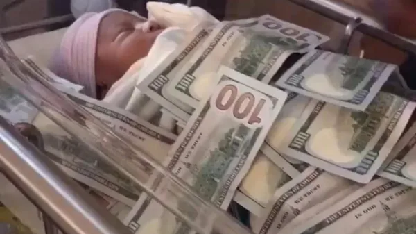 Man Covers Baby money