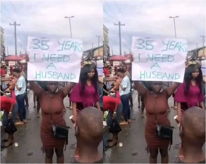 woman need husband placard street