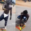 man cutting wee on street
